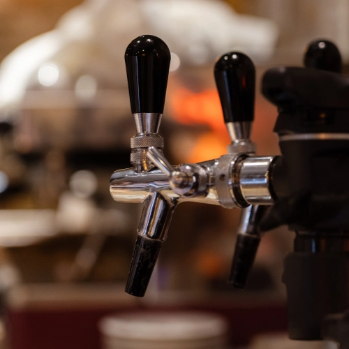Close-up of beer taps behind the bar at The Hare Arms