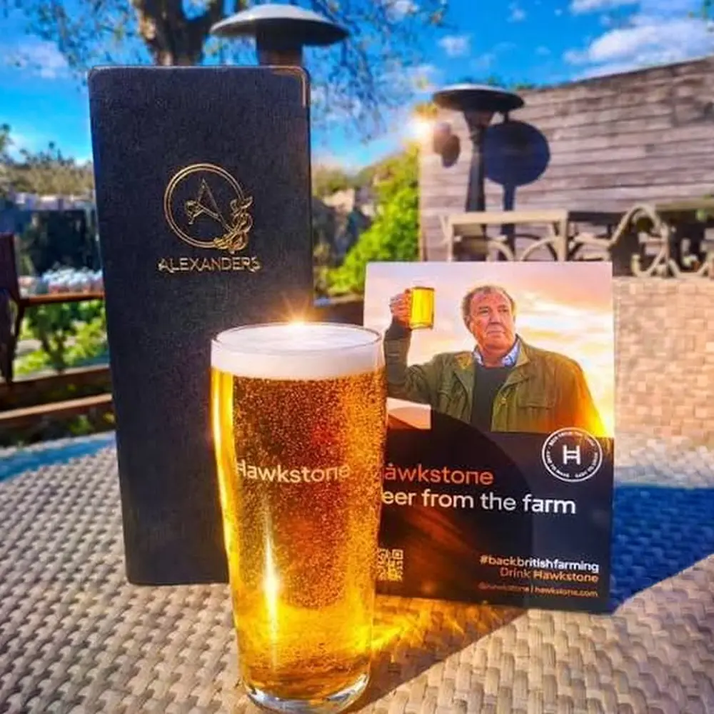 Pint of Hawkstone beer served outdoors at The Hare Arms