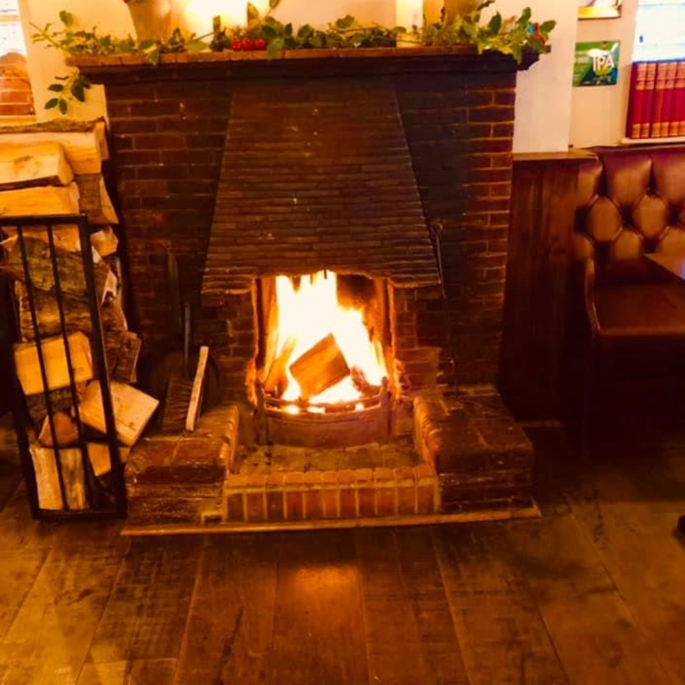 A welcoming open fire adds to the traditional atmosphere at The Hare Arms.